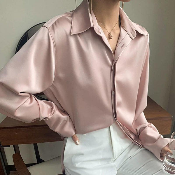 Is there any sexier way to wear a plain white satin blouse than